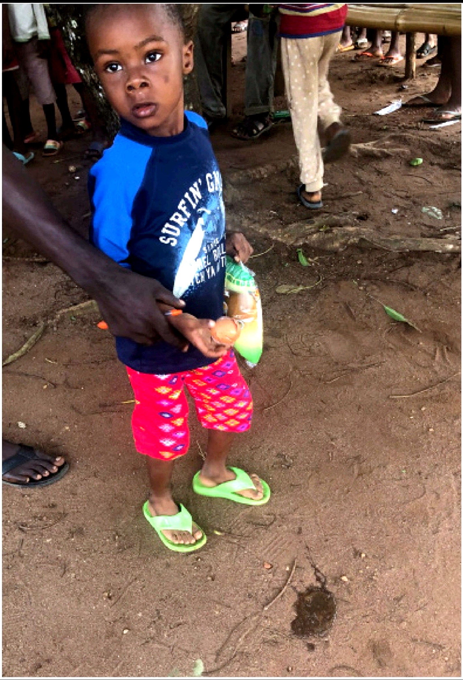 Child holding egg and food support package