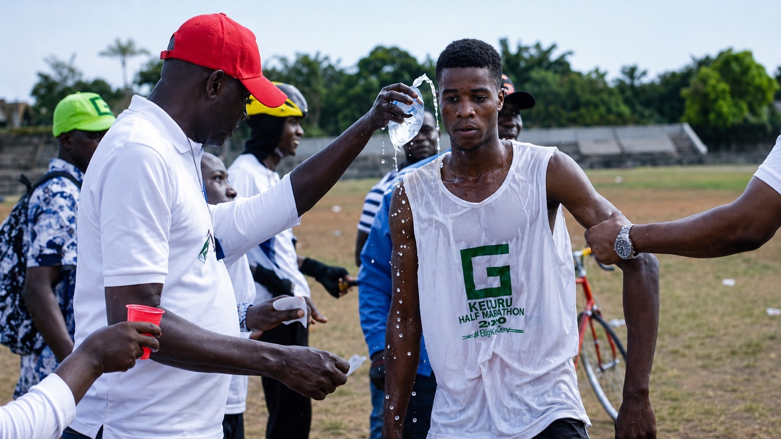 Athlete receiving hydration support during the Ikeduru Half Marathon